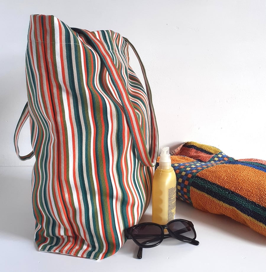 Beach or tote bag made in stripy colourful deck chair fabric with foldaway pouch