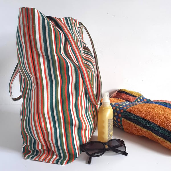 Beach or tote bag made in stripy colourful deck chair fabric with foldaway pouch