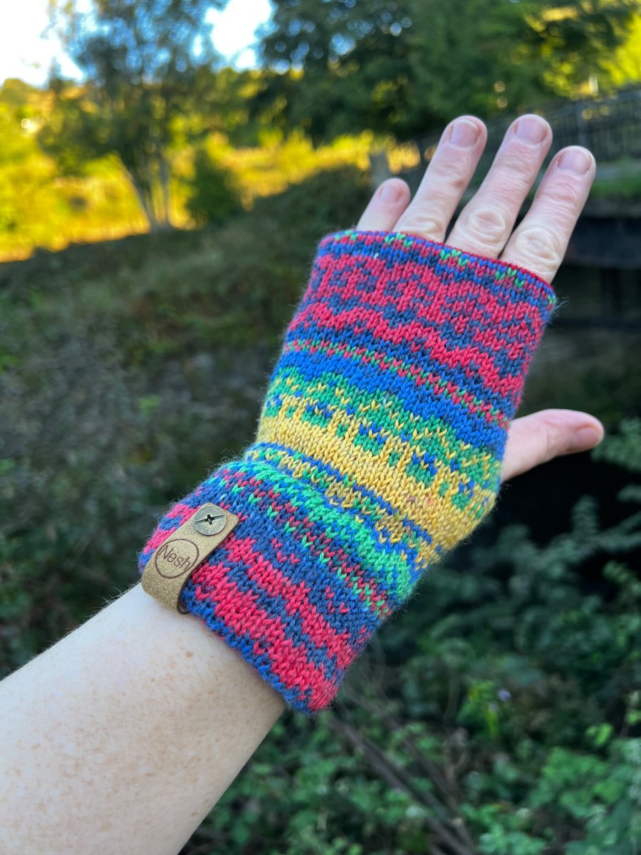 Image of Red, yellow and blue knitted fairisle wrist warmers super seconds festival
