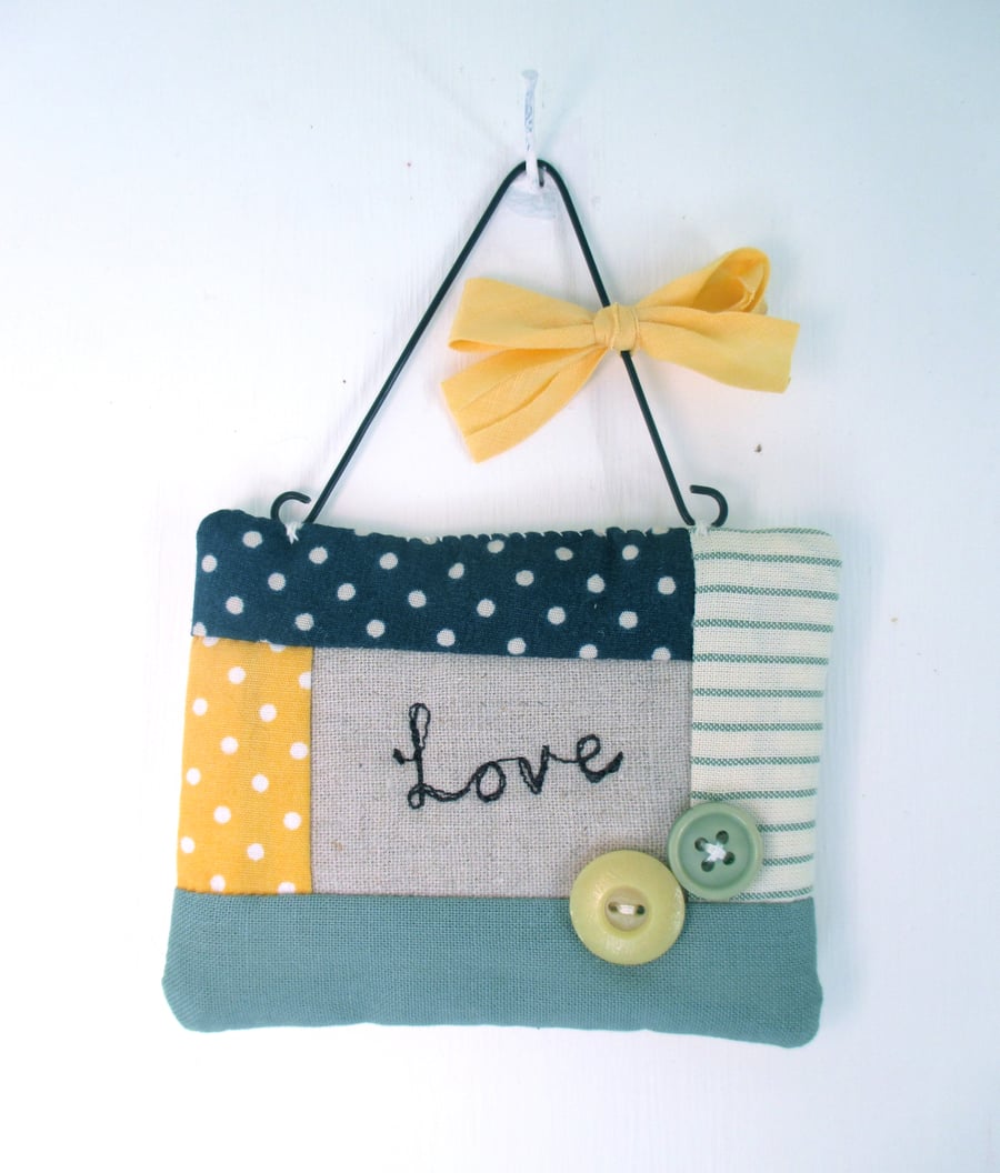 'Love' Hanging Quilted Fabric Quote with Button Decoration