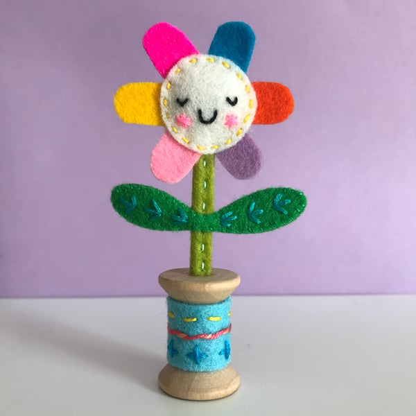Embroidered Happy Flower in Wooden Bobbin- pale lemon face with blue bobbin