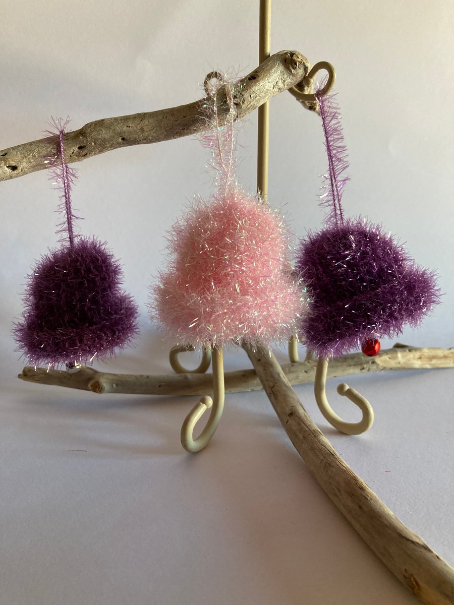 3 purple and pink hand knitted bells 