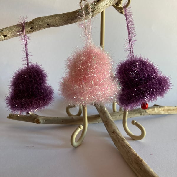 3 purple and pink hand knitted bells 