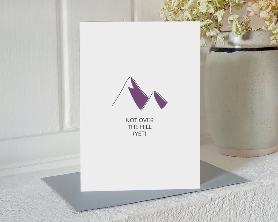 Mountain climbing birthday card - "not over the hill (yet)"