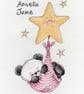 Party Paws Bamboo's baby girl swinging on a star - girl cross stitch kit - Image 1