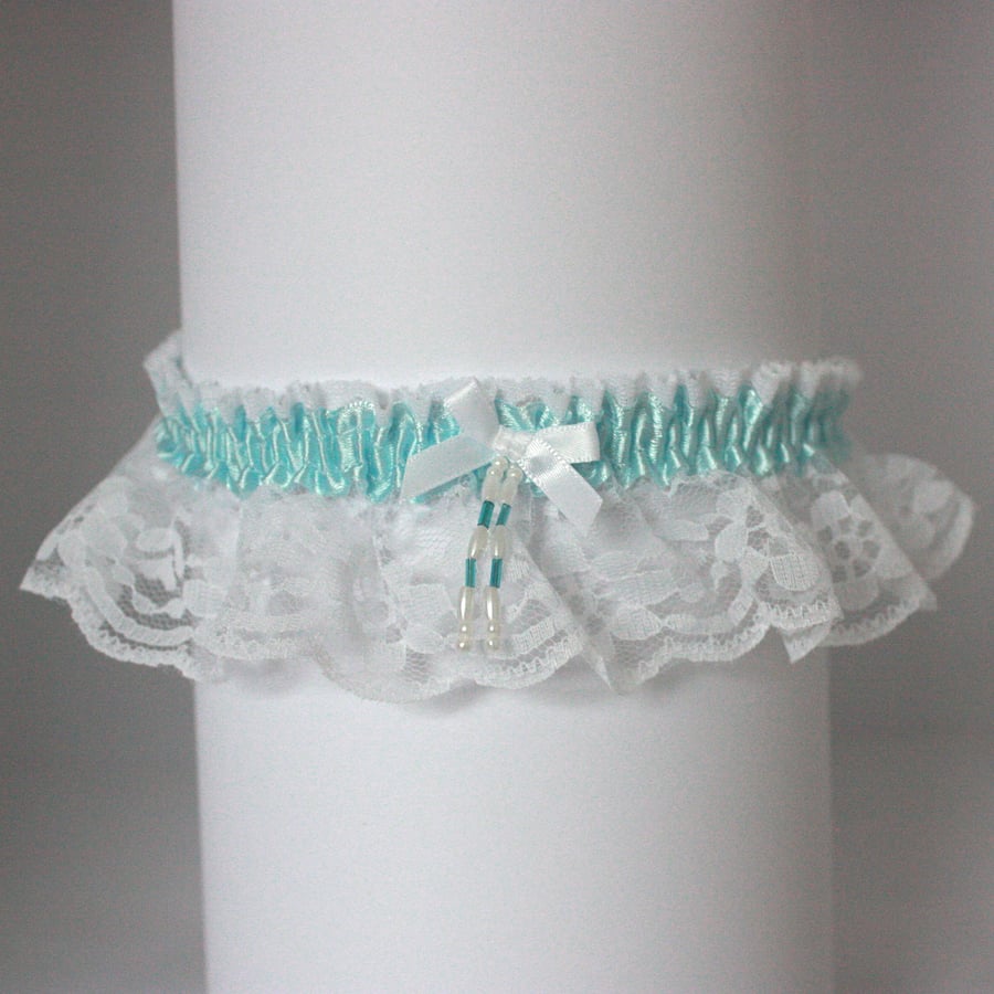 White lace wedding garter with aqua trim
