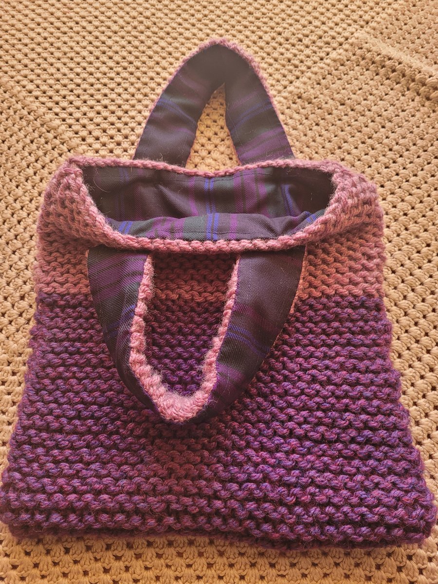 Hand knitted. 2 tone purple bag.  Tartan lined 