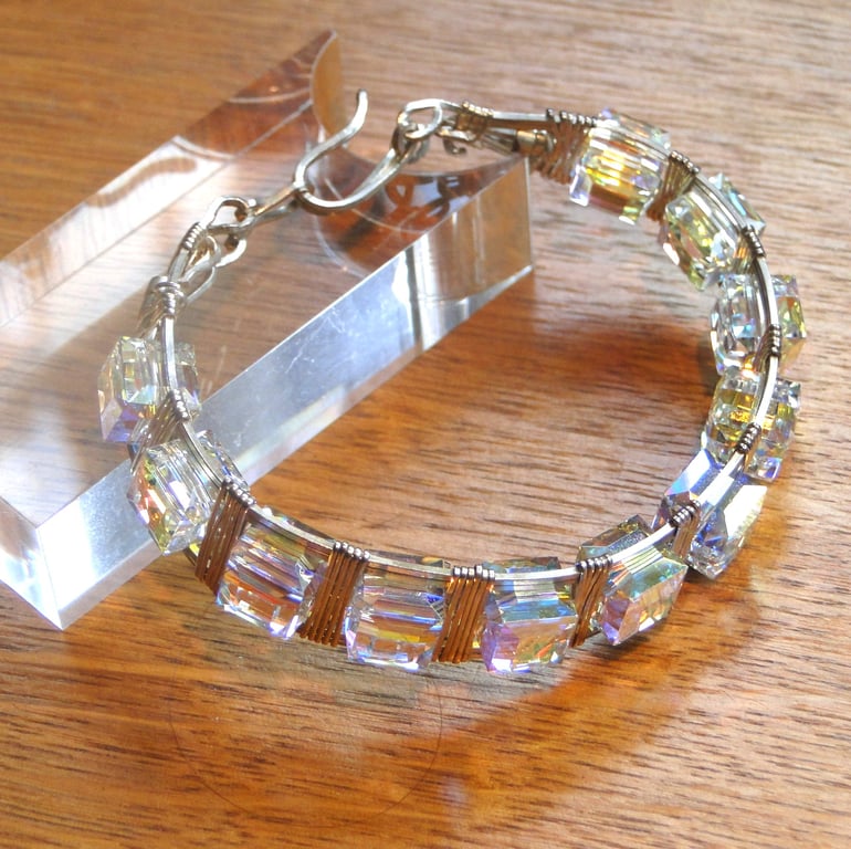A stunning wire wrapped Chrystal bracelet - Swarovski AB cubes with silver wrap