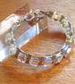 A stunning wire wrapped Chrystal bracelet - Swarovski AB cubes with silver wrap - Image 1