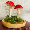 2 Red paper forest mushrooms in a glass dome 