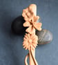 A unique hand carved wooden art spoon featuring relief carving on the handle