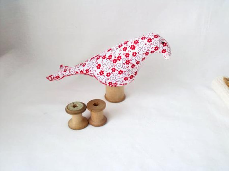 novelty bird ornament or bird pin cushion on a vintage wooden bobbin, red