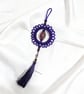 Purple Macramé Bag Charm with Tassel and Floral Glass Bead