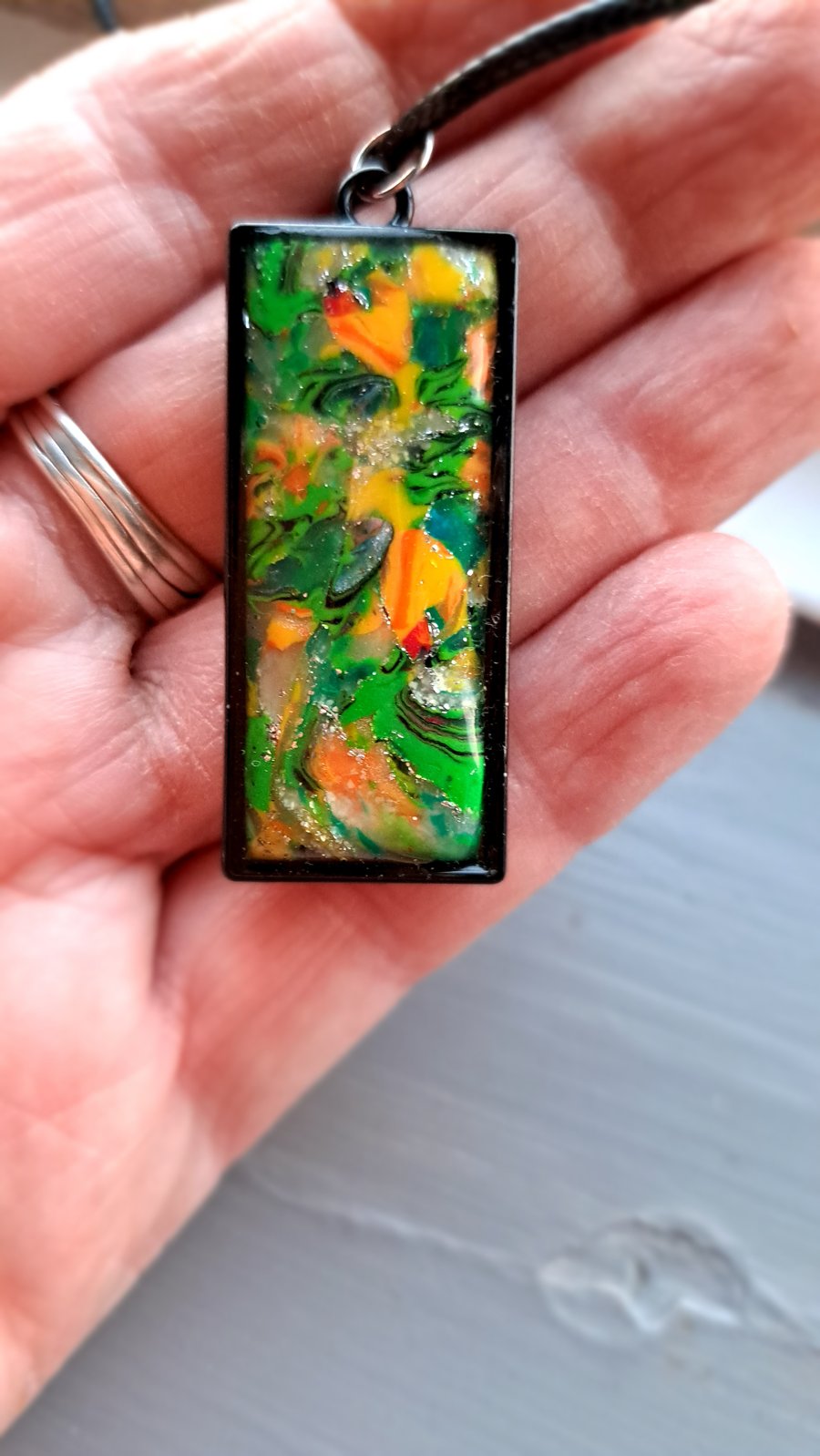 Rope necklace, with a polymer clay filled bezel..