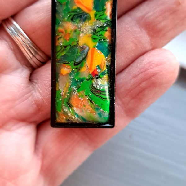 Rope necklace, with a polymer clay filled bezel..