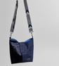 Navy blue and checked waterproof canvas slouch bucket bag