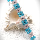 Turquoise and Pink Facetted Glass Bead Bracelet. Free UK Postage