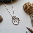 Sterling Silver Pendant. Oval Ring with stamen detail on 16" Rope Chain