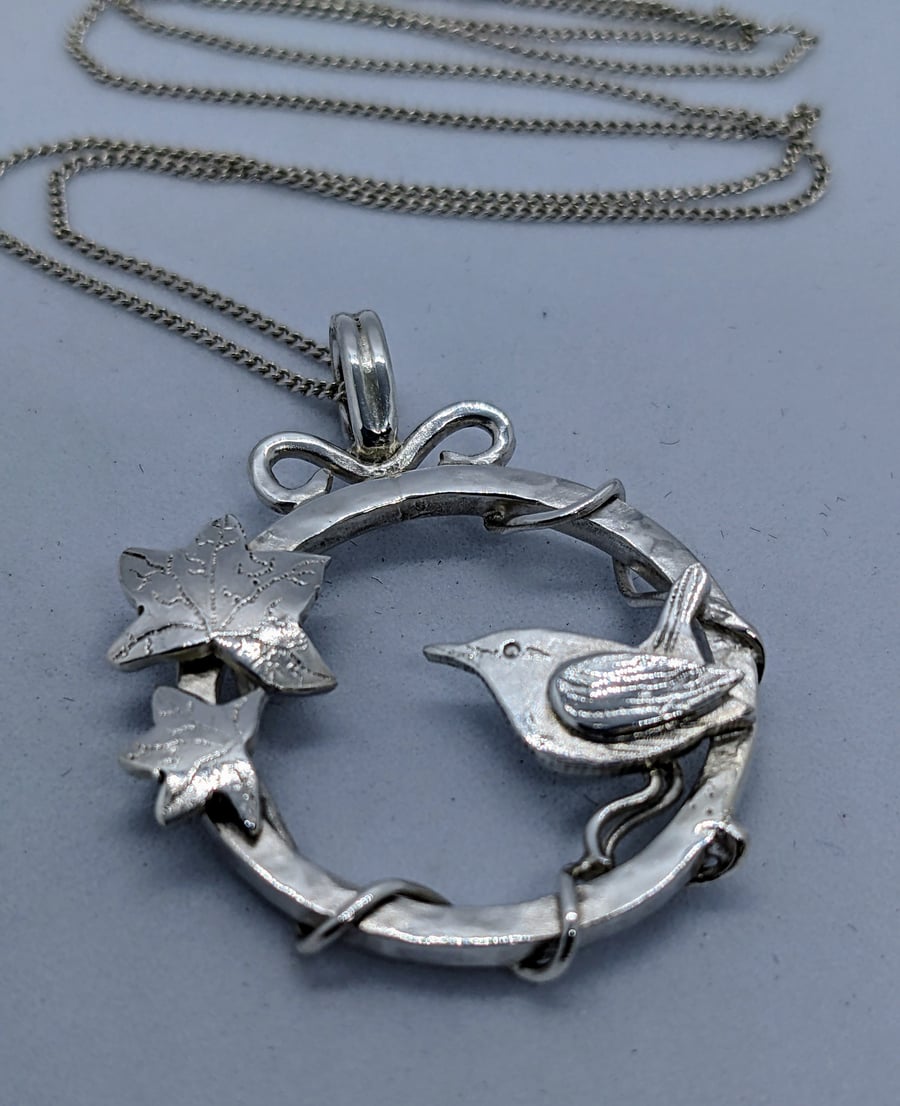 Handmade sterling silver pendant with wren and ivy leaves