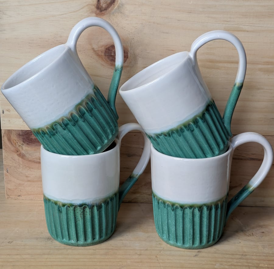 Matte jade green & white carved mugs