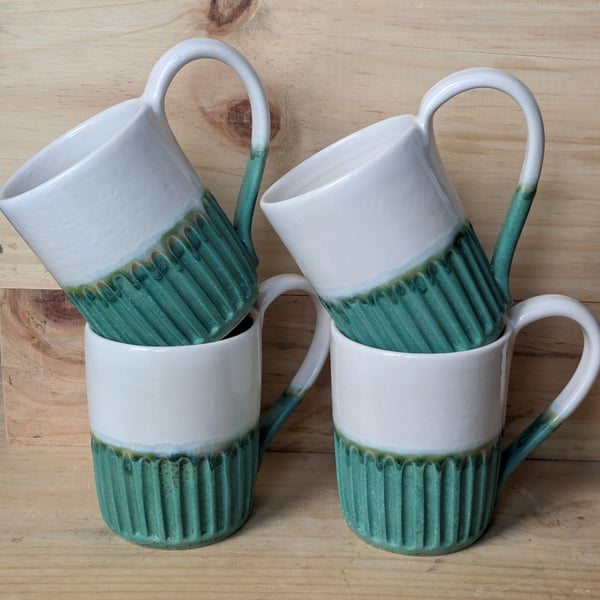 Matte jade green & white carved mugs