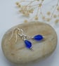 Beautiful silver plated earrings with a lovely royal blue glass teardrop faceted