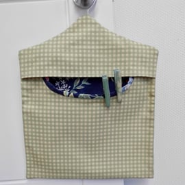 Peg bag in blue-green check with floral lining