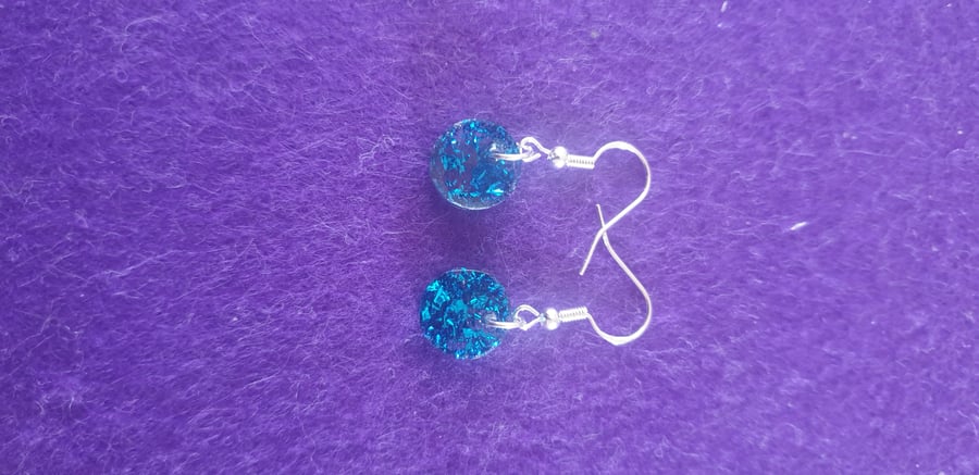 Round blue metallic flakes resin earrings