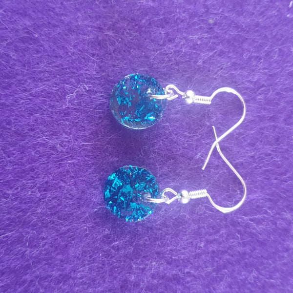 Round blue metallic flakes resin earrings