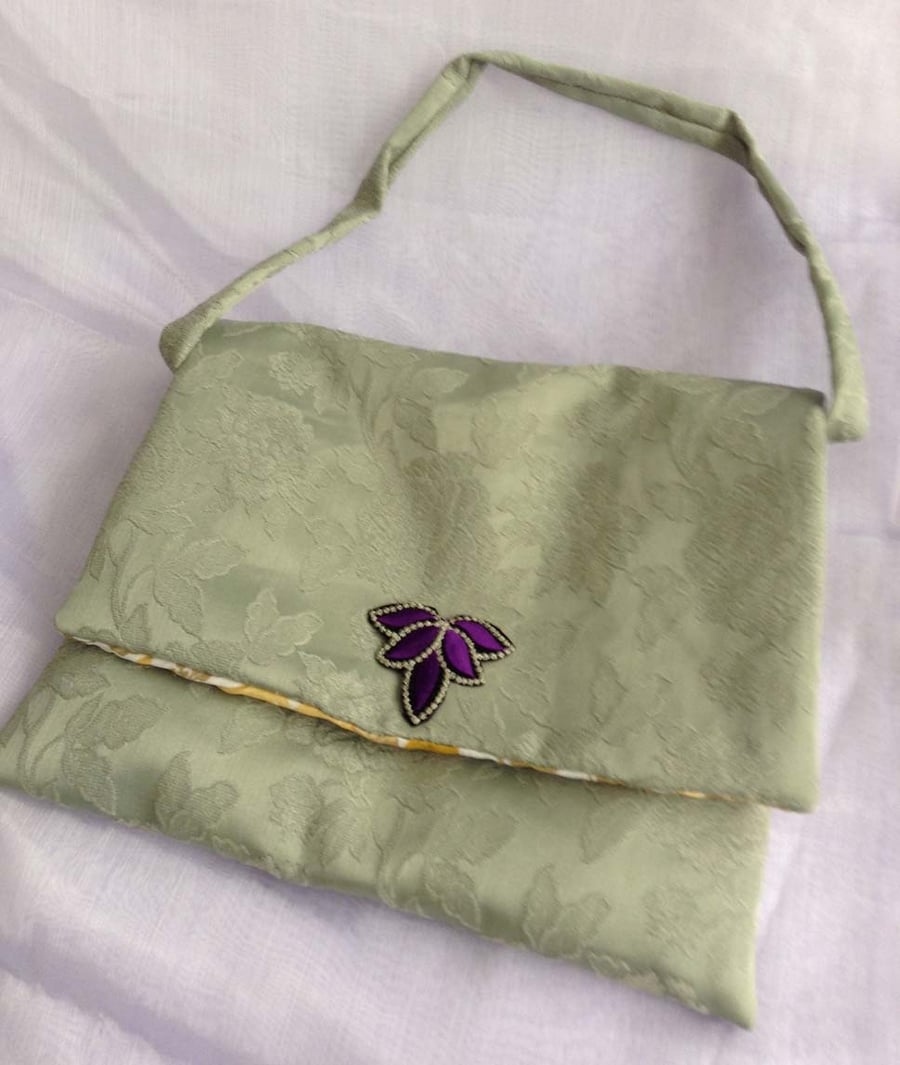 Green floral messenger bag