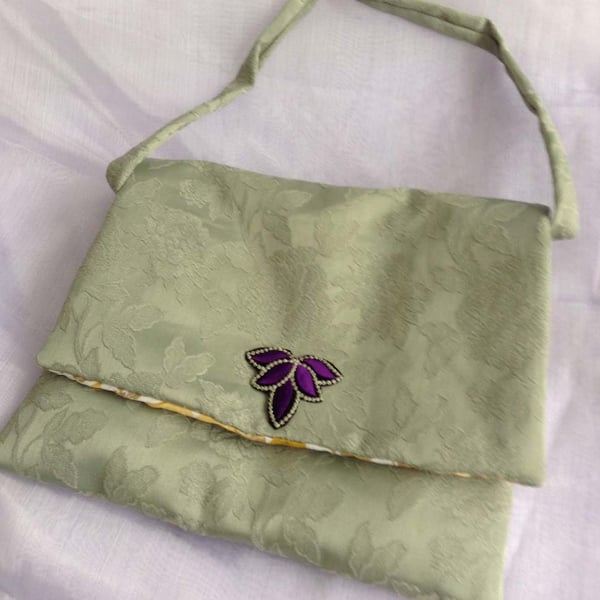 Green floral messenger bag