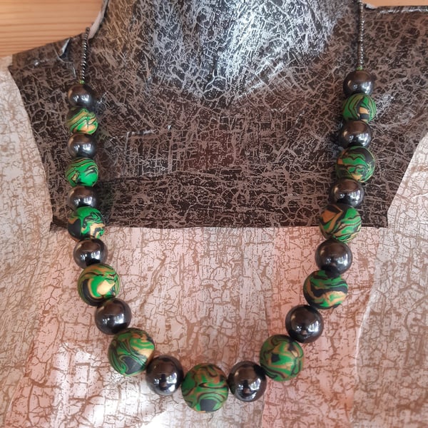 Green, gold and black necklace