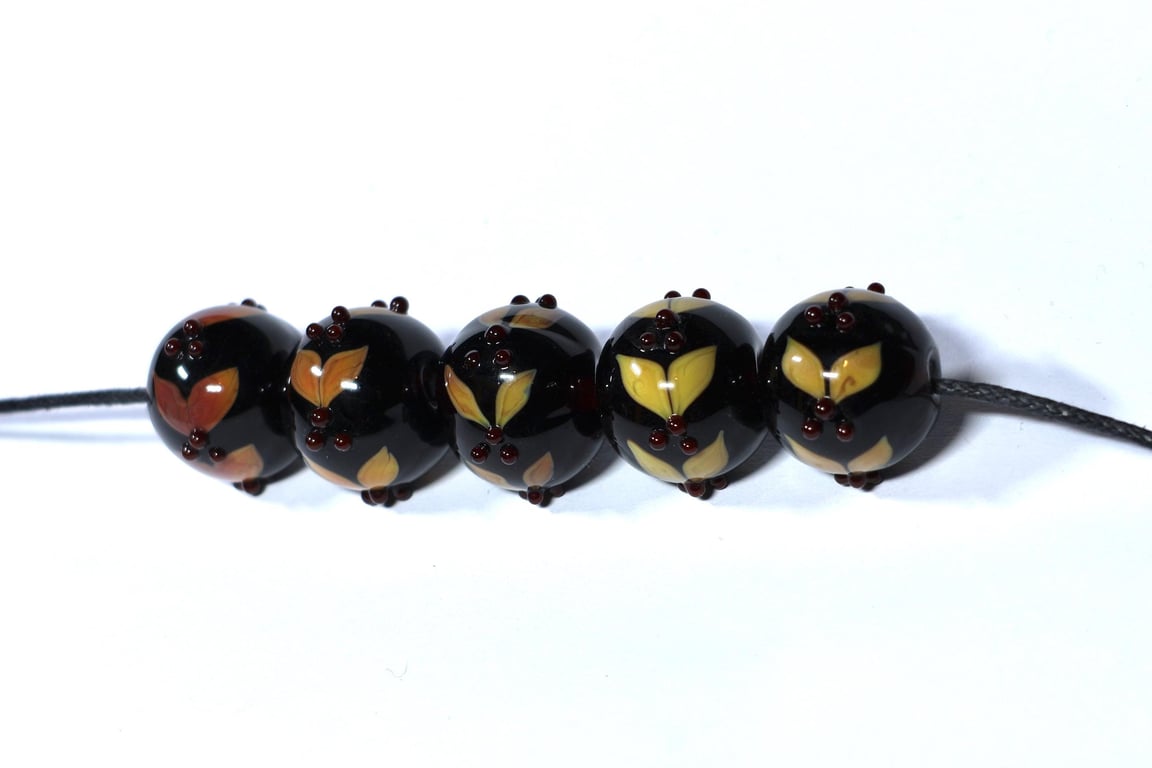 Handmade brown and amber lamp work glass beads