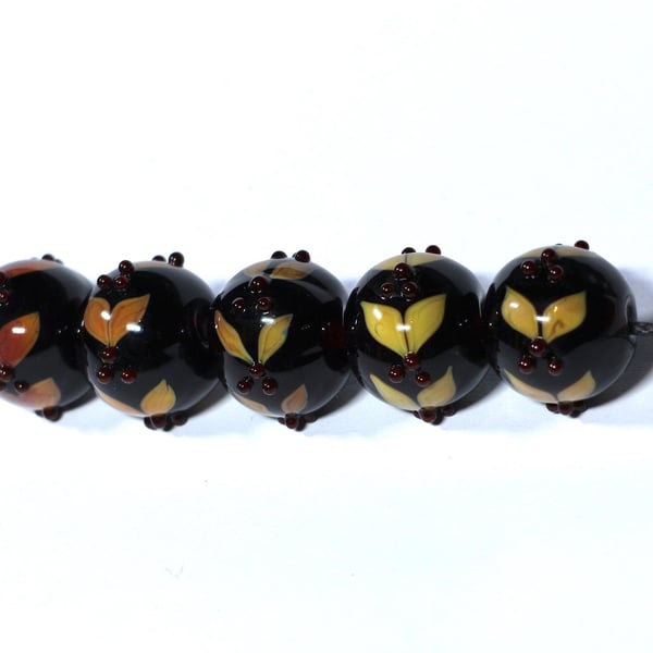 Handmade brown and amber lamp work glass beads