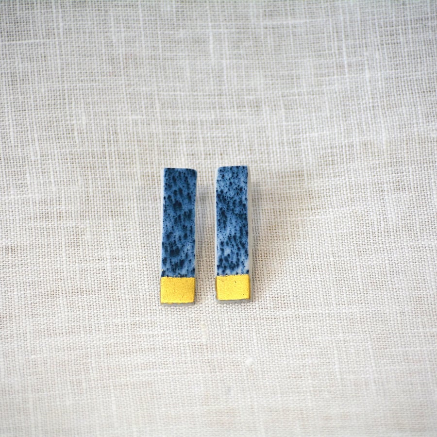 Long porcelain earrings with gold leaf