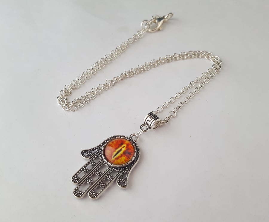 Orange dragon eye Hamsa hand pendant on silver chain