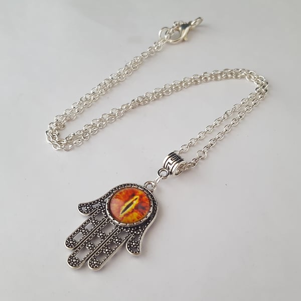 Orange dragon eye Hamsa hand pendant on silver chain