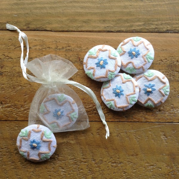 2 hand embroidered buttons