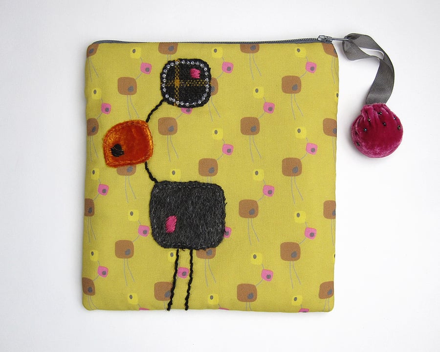 Mustard make up bag with mid-century sculpture print and appliqué