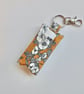 Key ring lip balm holder in mustard and black floral fabric keyring 