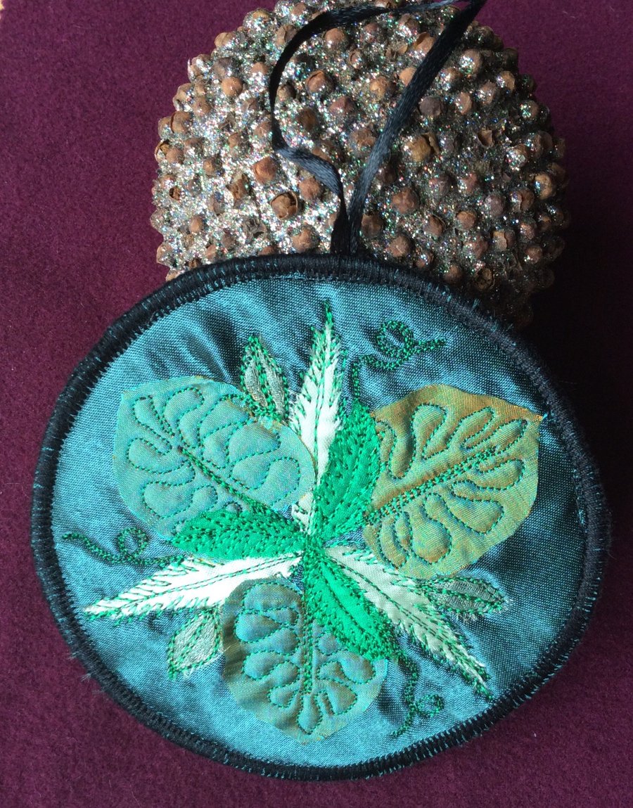 Handmade embroidered leaf decoration. 