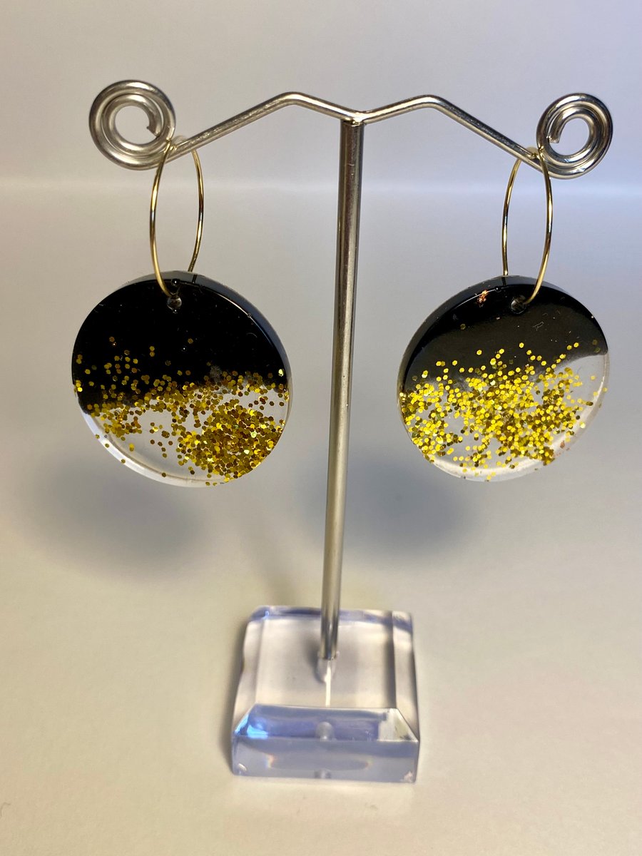 Handmade black resin and biodegradable gold glitter disc hoop earrings