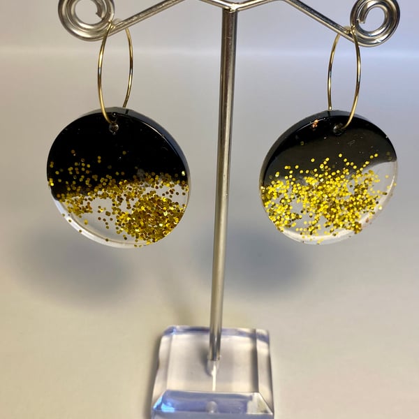 Handmade black resin and biodegradable gold glitter disc hoop earrings