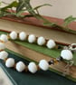 Glass bead bracelet in crisp white vintage beads with extension chain - Image 2