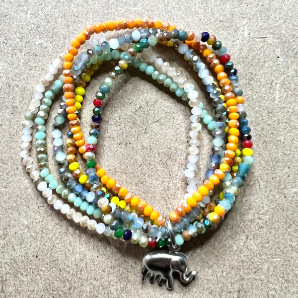 Multi strand elasticated bracelet with elephant charm