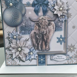 Highland cow and calf in a snowy scene Christmas card