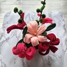 Beautiful original table decoration in pinks and reds.  