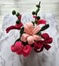 Beautiful original table decoration in pinks and reds.  