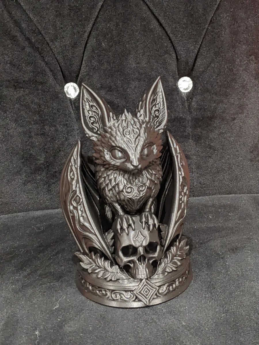 Gothic Style bat perched on a skull home decor ornament