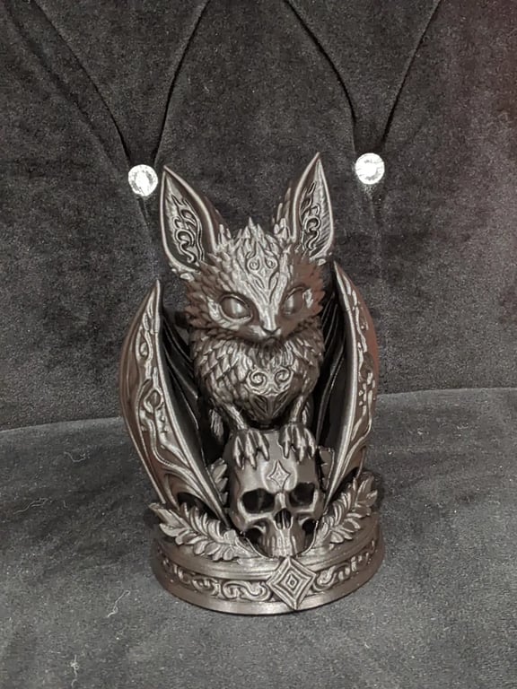 Gothic Style bat perched on a skull home decor ornament